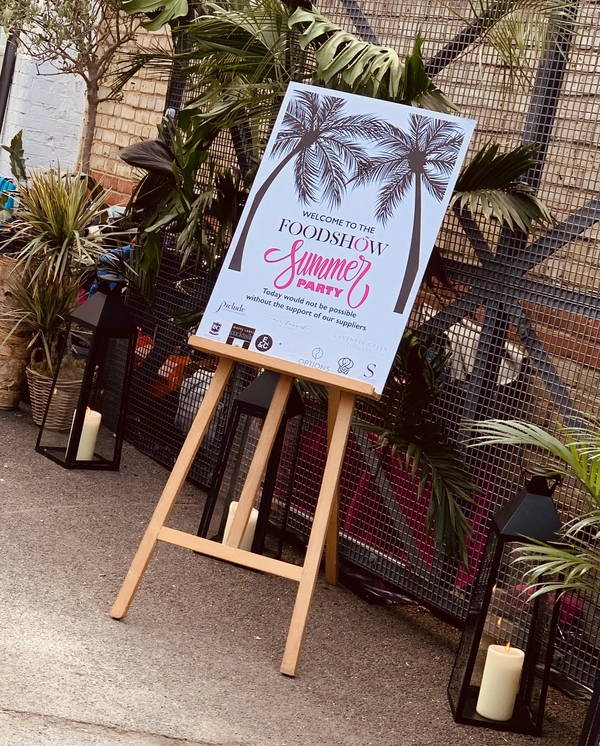 Foodshow Summer Party welcome poster on an easel, printed by Furnival Press for a London event